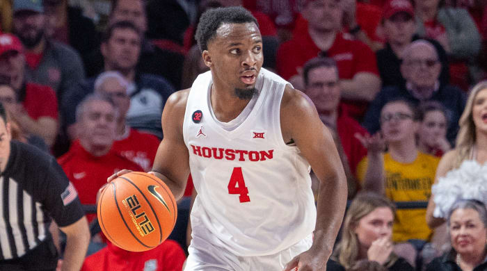 Houston guard L.J. Cryer dribbles against West Virginia